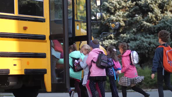 Diverse Joyful Pupils Hurrying To Enter School Bus alt