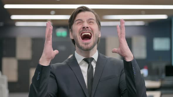 Portrait of Businessman Shouting and Screaming in Anger alt