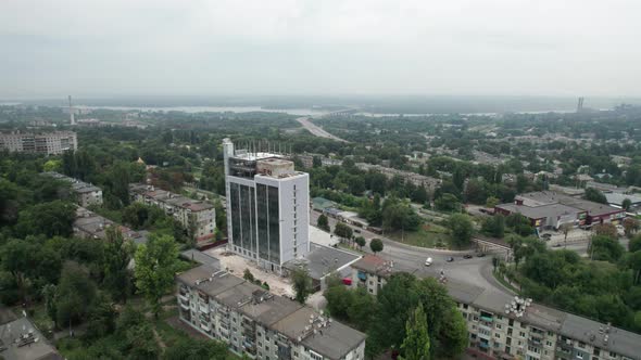 Aerial View of a Small Town Urban Landscape Flying By Houses Near Green Spaces alt