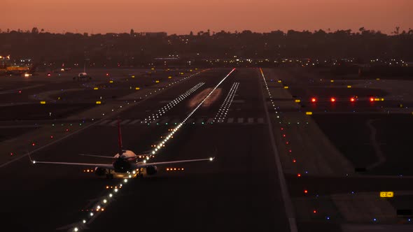 Airport Runway Lights at Night Plane or Airline Taking Off Airstrip at Sunset