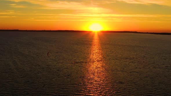 Aerial view young people kite surfing in the Baltic Sea, Gdansk. Poland. Drone view of the ocean and alt