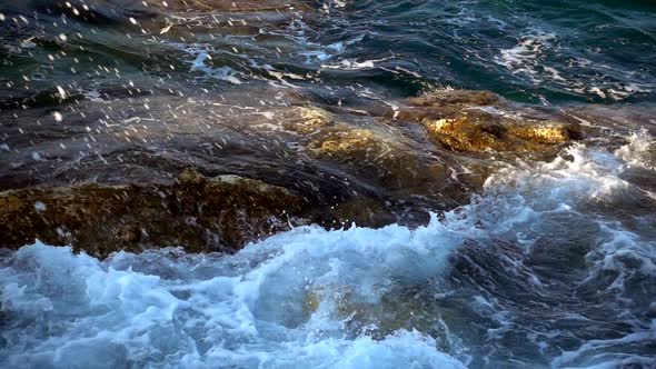 Waves Foam On Rocks