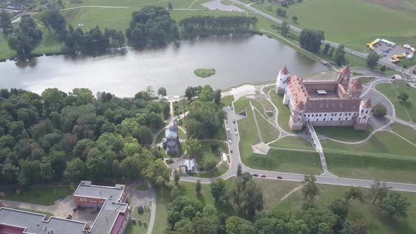 Aerial Shot of Mir Castle in Belarus. Bird's Eye View of Beautiful Mir Castle in Autumn. Shooting alt