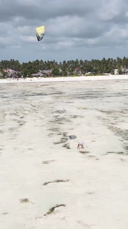 Tanzania  Vertical Video Kitesurfing Near the Shore of Zanzibar Slow Motion alt