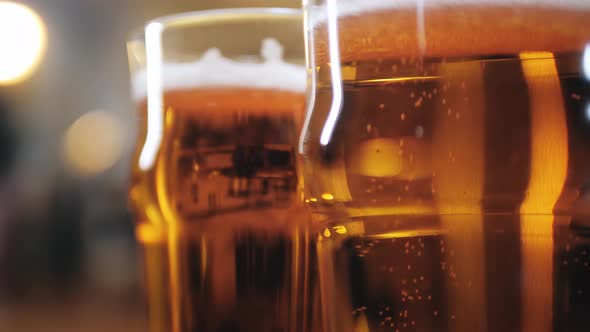 Foamy Beer in Glasses Closeup alt
