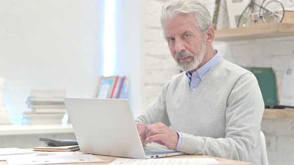 Thumbs Up By Old Man at Work alt