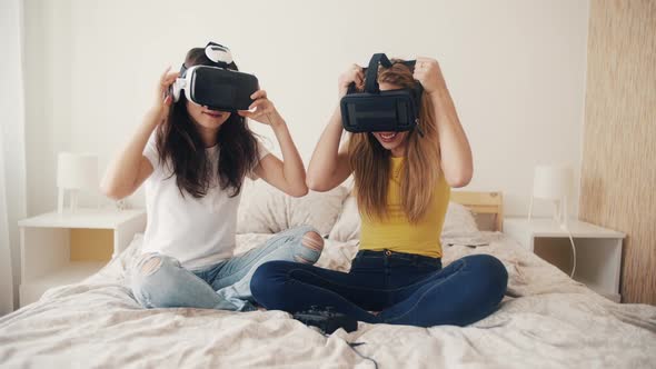 Exited Girls in VR Helmets at Home alt