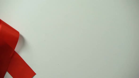 1st of December World AIDS Day Inscription, Female Placing Red Ribbon on Table alt