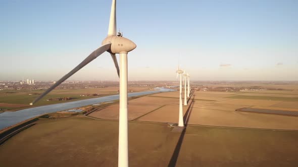 Aerial view of a wind turbine in slow motion. Green energy concept alt