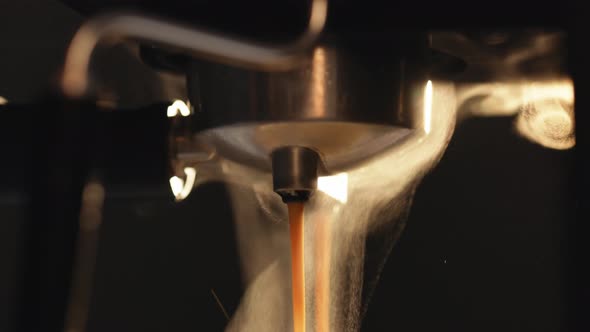 Pouring Coffee Stream From Professional Coffee Machine
