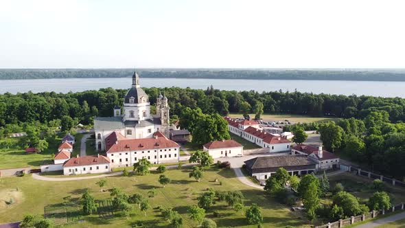 Main complex building with dome of Pazaislis monastery, aerial orbit view alt