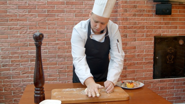 Chef kneading a dough