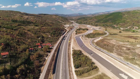Highway motorway near Pirot, Serbia. Low aerial drone shot flying backwards