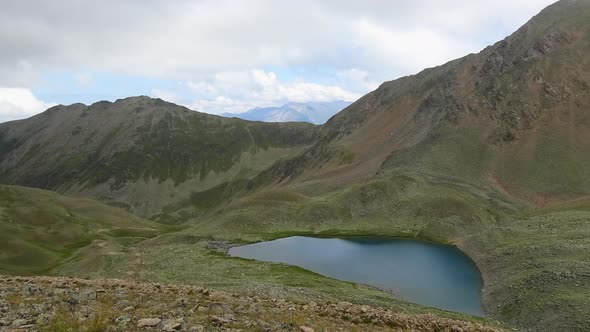 Time lapse lake scene in mountains, national park of Dombay, Caucasus, Russia