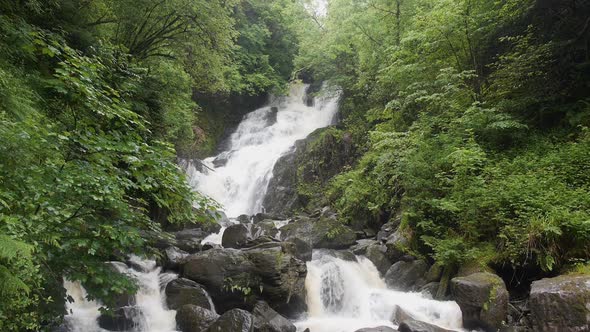Cinemagraph of Flowing Water at Base of Waterfall alt