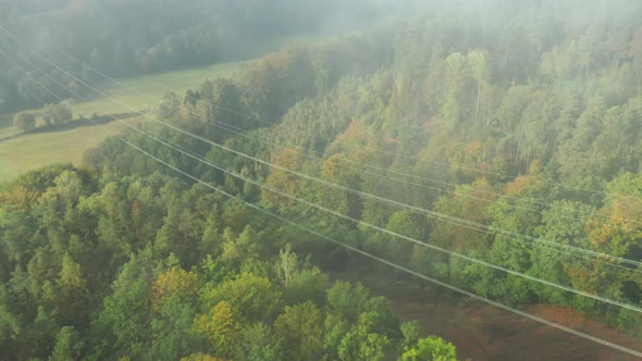 Flight Along High Voltage Power Lines and High Voltage Electric Transmission Tower or Pylon on the alt