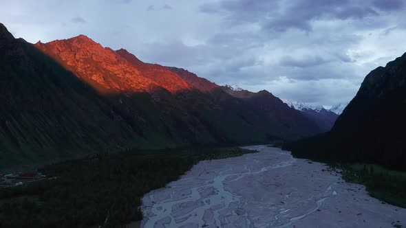 River and mountains at sunset alt