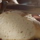 Male Holding A Crusty Bread Load And Cutting A Piece With A Knife In Slow Motion Shot On Red Camera - VideoHive Item for Sale