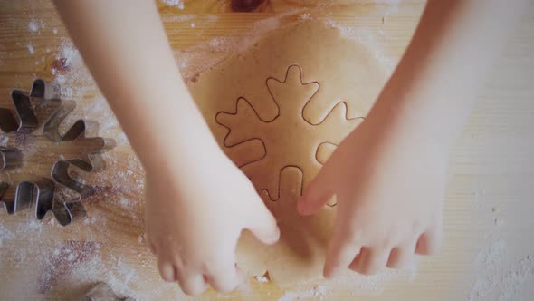 Child making christmas cookies