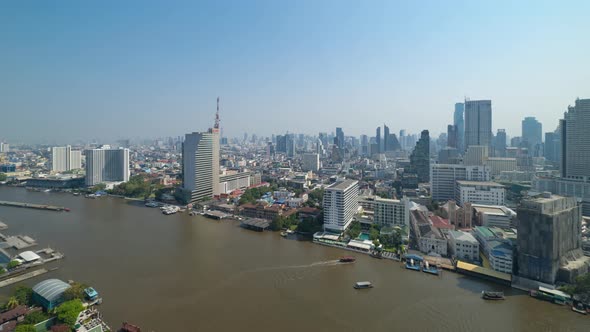 Time lapse of Bangkok City skyline by Chao Phraya River in Thailand. Financial district