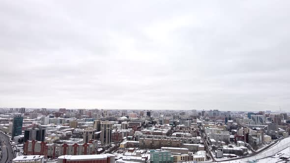 Aerial Photography of a Snowcovered City Against the Background of a White Sky in Winter alt