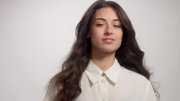 Young Brunette Woman Alone in Studio Portrait. Smiling Happy Woman