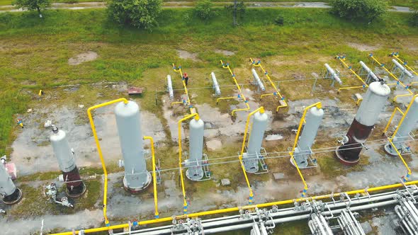 Gas Production. Large Gas Distribution Complex. A Gas Worker or a Station Operator Shuts Off the Gas alt