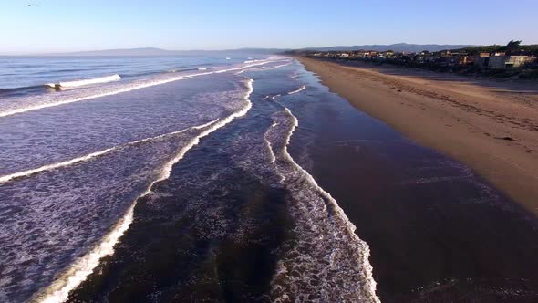 Aerial Drone Tracking Shot of Beach in Early Morning 2
