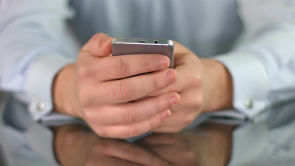 Man Watching Film on Smartphone, Hands Scrolling Screen Closeup alt