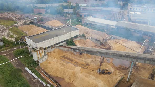 Aerial View of Wood Processing Factory with Smoke From Production Process Polluting Atmosphere at alt