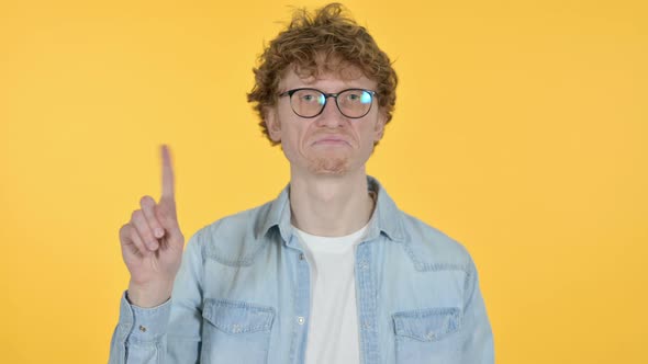 Redhead Young Man No Sign By Finger, Yellow Background  alt