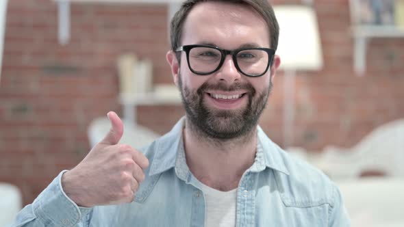 Portrait of Successful Beard Young Man Showing Thumbs Up alt