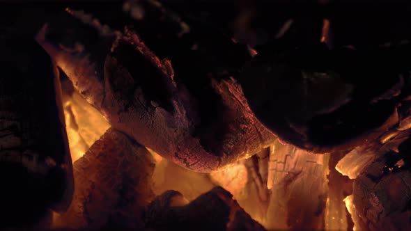 High Speed Macro Close-Up of Burning Flaming Charcoal Briquettes on a Hot Barbecue Fireplace