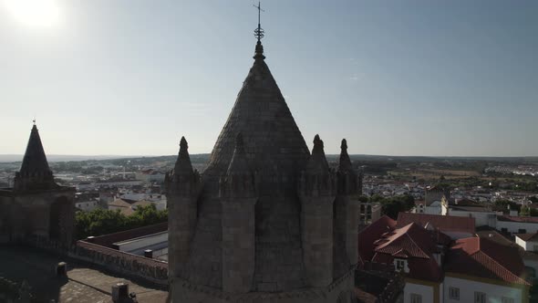 Aerial circular view over towers of monumental cathedral. Evora, Portugal