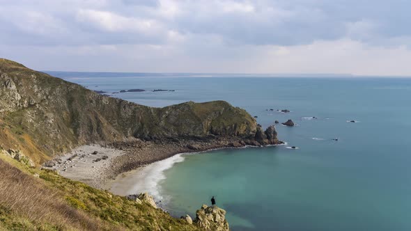 La Hague France Timelapse  A Man Look at the Ocean in the Nez De Jobourg During the Day alt