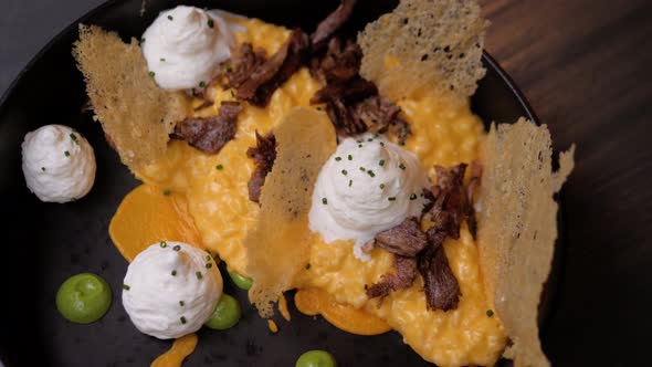 Italian Fresh Risotto with Pumpin and Parmesan in Modern Restaurant, Chef Served High Level Kitchen alt