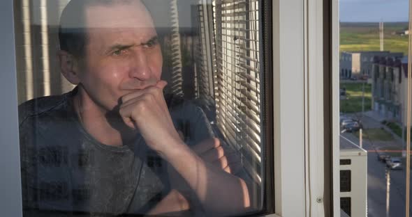 Man with Stress By Window alt