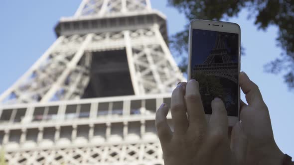 Crop Woman Taking Photo of Eiffel Tower alt