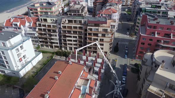 Aerial View of the Construction of Apartments in the Area with Streets and Cars Near the Black Sea alt