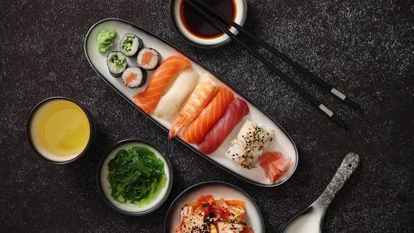 Asian Food Assortment. Various Sushi Rolls Placed on Ceramic Plates alt