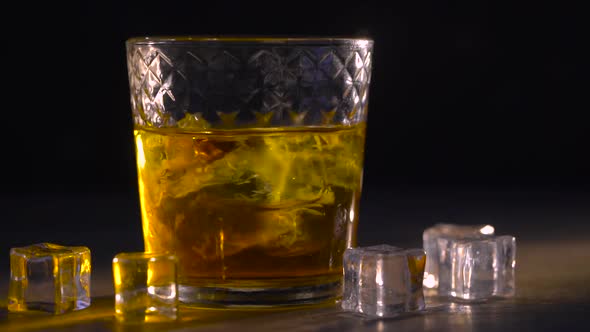 Whiskey in Glass with Cubes of Ice alt