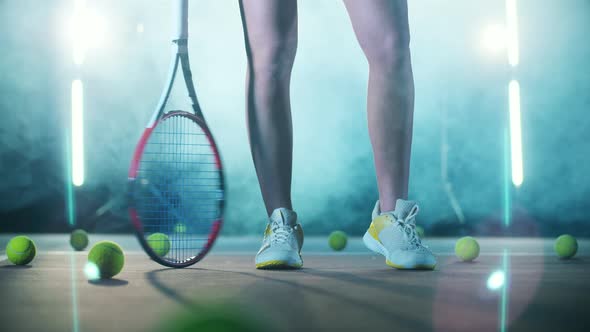 Legs of an Athletic Woman Standing in the Tennis Hall alt