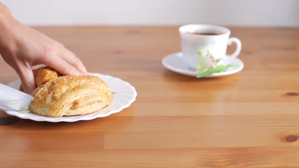 Woman Cuts Fresh Pastry Stuffed for Breakfast