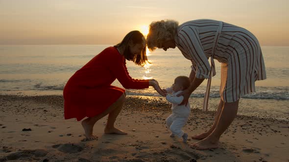 Mom and Grandmother with Granddaughter on the Beach