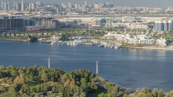 Aerial View of Blue Canal Near Green Park Dubai City United Arab Emirates Timelapse alt