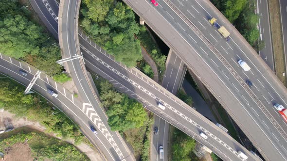 Time Lapse of Vehicles in a Mixing Bowl Interchange Bird's Eye View alt