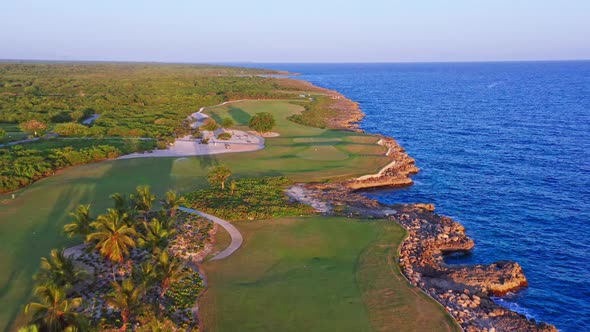 Birds eye view of golf course of Playa Nueva Romana in Dominican Republic. Aerial forward alt