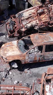 Vertical Video of Burnt Cars During the War in Ukraine alt