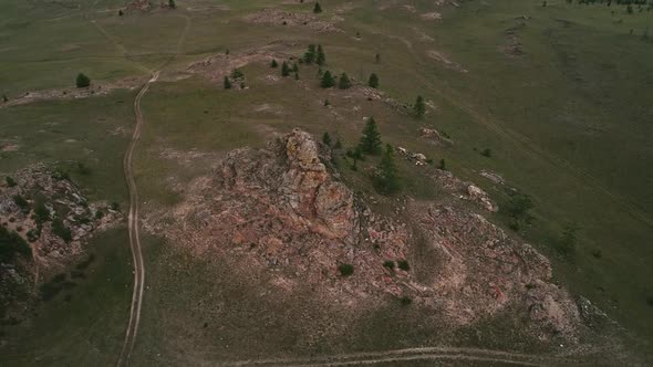 Baikal Valley spirits,Tazheran Steppe, Stone Cliffs on the Road. Aerial Summer alt