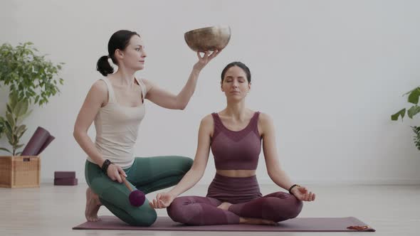 Woman Meditating during Yoga Classes alt
